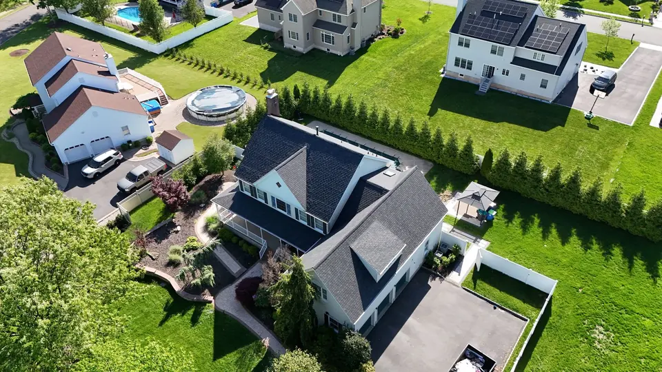 Newly shingled roof on a home in a Central New Jersey neighborhood, aerial view