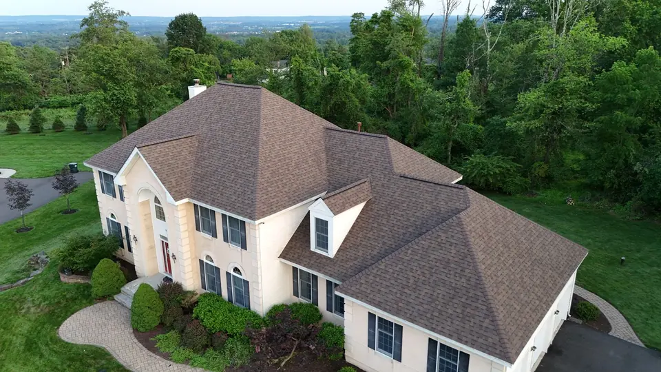 Tan shingle roof on a hilltop home overlooking the Central New Jersey countryside