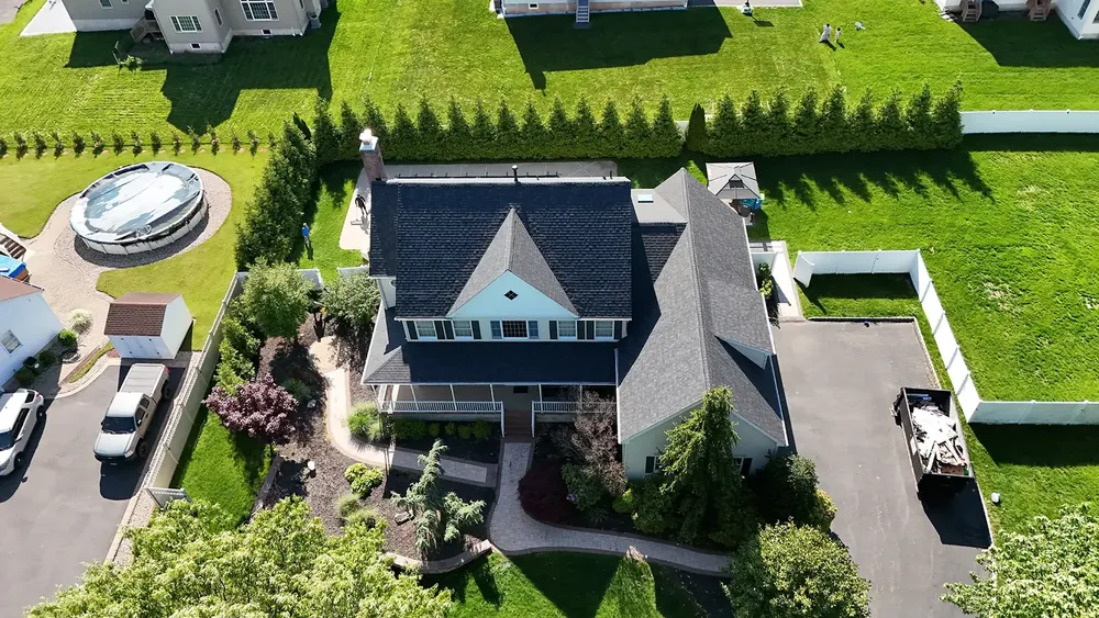 Roof replacement with new skylight in Belle Mead, NJ, Williamsburg Gray shingles