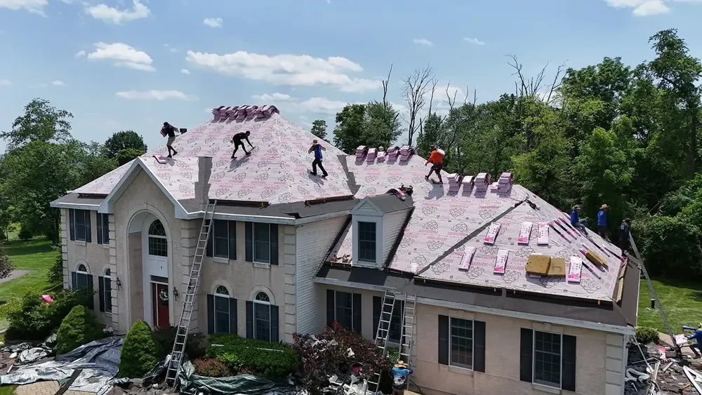 New roof with skylights, gutters and gutter guards in Flemington, NJ, Teak shingles