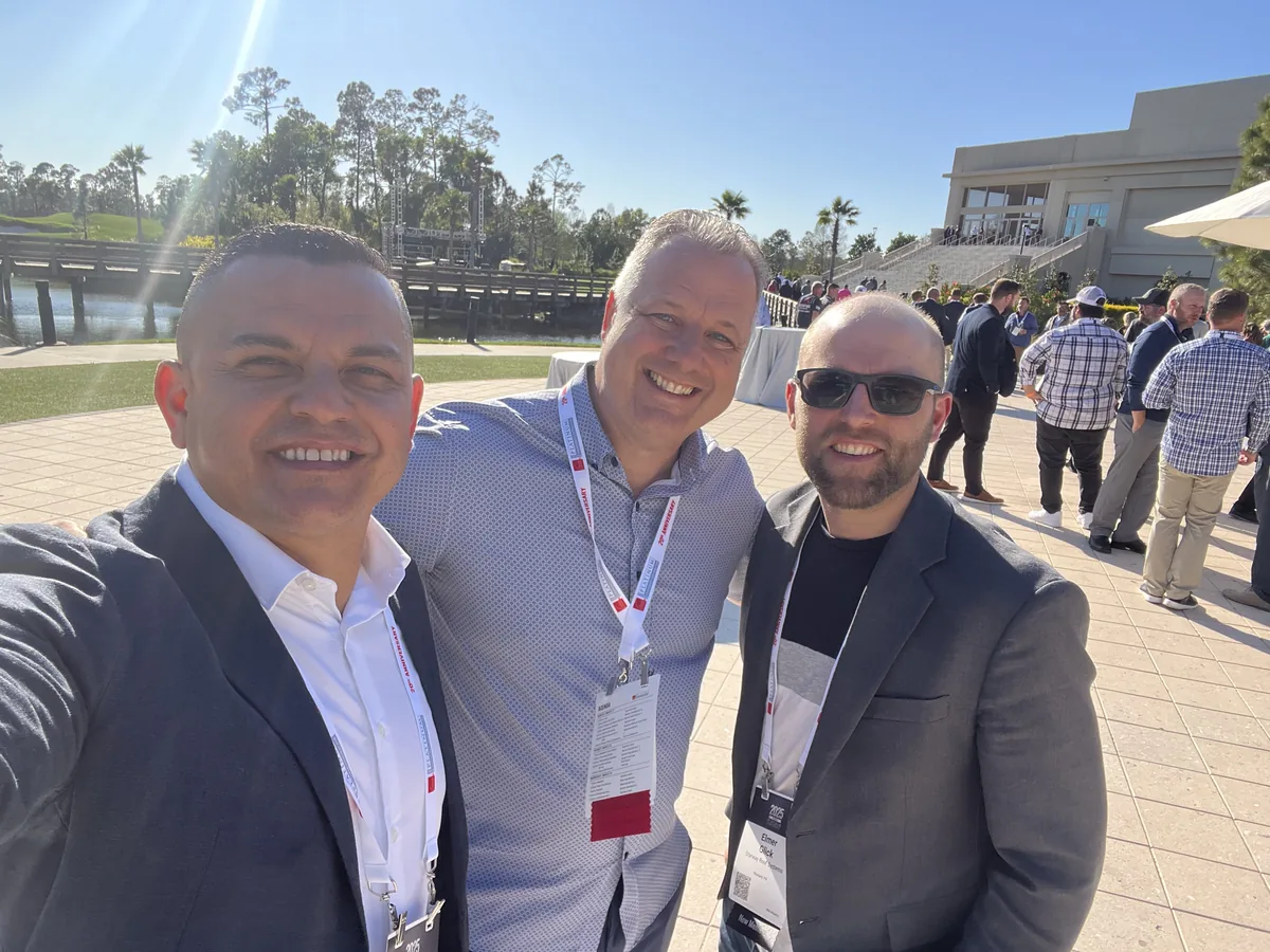 Three members of the Skylight Roofing team at the Owens Corning contractor event in Orlando, Florida