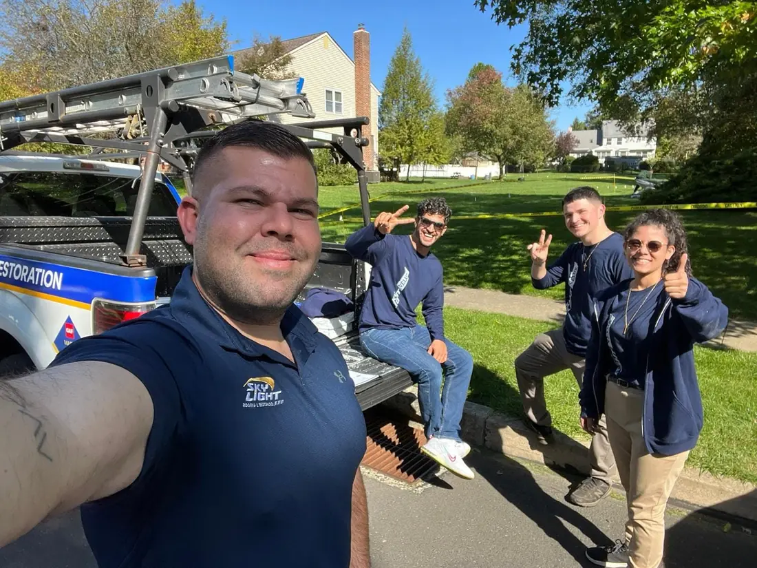 The Skylight Roofing crew with their truck on a Central New Jersey street
